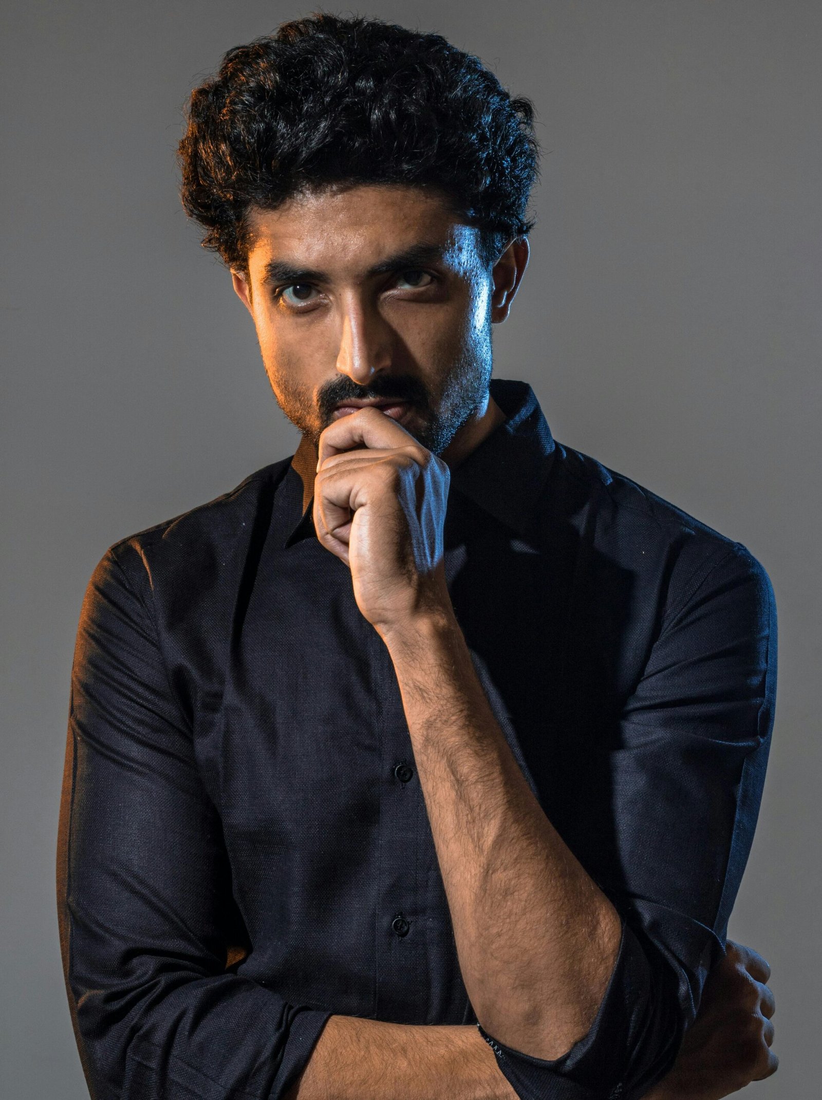 Photo of Man Holding His Chin